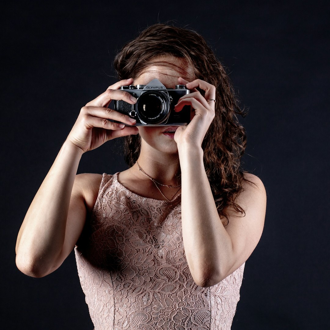 Studio portrait of a female camera operator