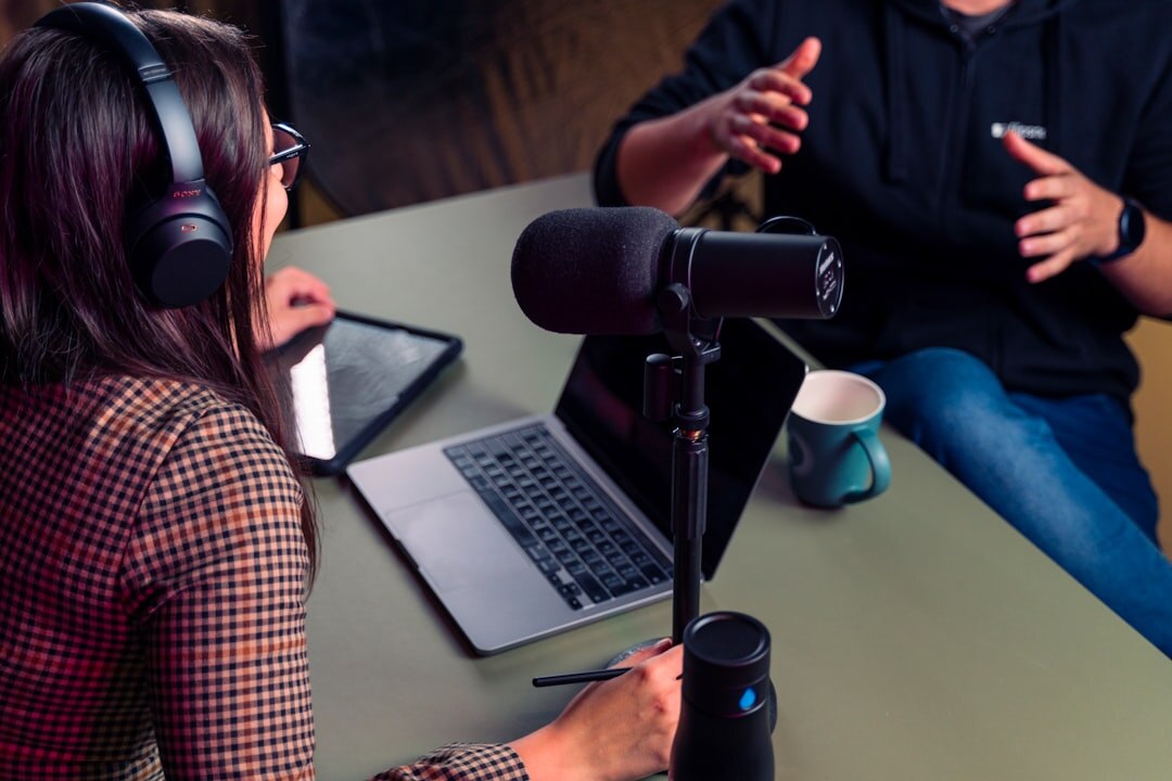 Journalists recording a podcast with microphones